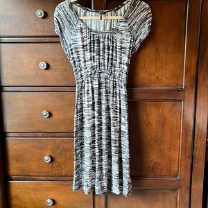 Rayon/spandex dress in black, gray and white. In very good preowned condition.